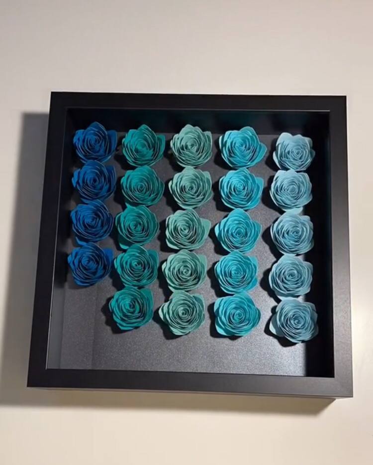 assembling the paper flower shadow box