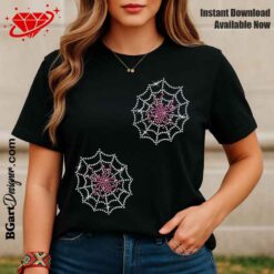 Mockup of a custom Halloween t-shirt using a digital rhinestone spider web template. A woman wearing a black tee features two instances of the sparkling rhinestone design with a pink spider. The image shows how the bling design looks on apparel and promotes an instant download of the rhinestone SVG cut file from BGartDesigner.com. Perfect for US female entrepreneurs using Cricut and Silhouette.